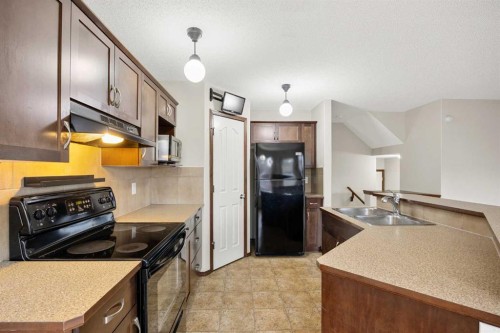 49 Sage Valley Manor Nw, Calgary, AB - Indoor Photo Showing Kitchen With Double Sink