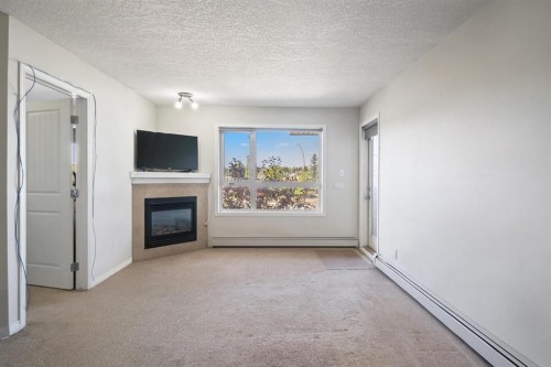 302-8200 4 Street Ne, Calgary, AB - Indoor With Fireplace