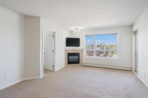 302-8200 4 Street Ne, Calgary, AB - Indoor With Fireplace