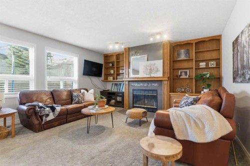 239 Sandpiper Place Nw, Calgary, AB - Indoor Photo Showing Living Room With Fireplace