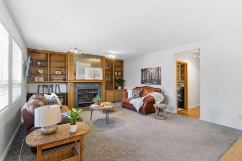 239 Sandpiper Place Nw, Calgary, AB - Indoor Photo Showing Living Room With Fireplace
