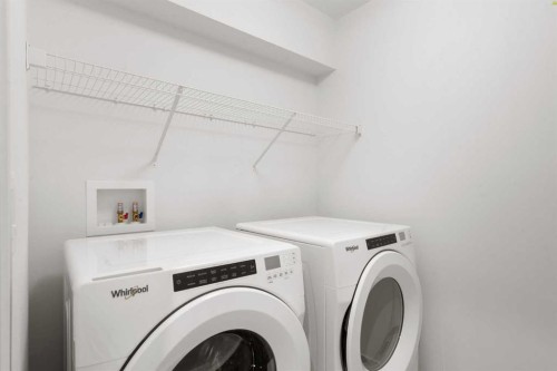 76 Lucas Common Nw, Calgary, AB - Indoor Photo Showing Laundry Room
