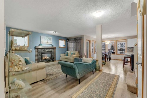 172 Covehaven Road Ne, Calgary, AB - Indoor Photo Showing Living Room With Fireplace