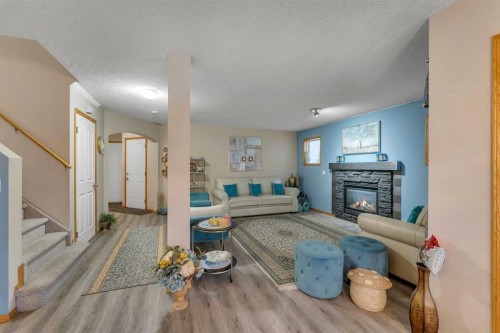 172 Covehaven Road Ne, Calgary, AB - Indoor With Fireplace