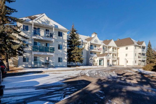 108-309 Woodside Drive Nw, Airdrie, AB - Outdoor With Deck Patio Veranda With Exterior