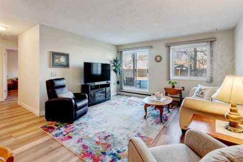 108-309 Woodside Drive Nw, Airdrie, AB - Indoor Photo Showing Living Room