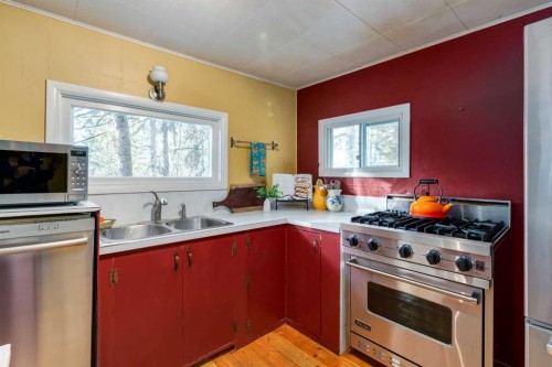 10-32376 Highway 760, Rural Mountain View County, AB - Indoor Photo Showing Kitchen With Double Sink