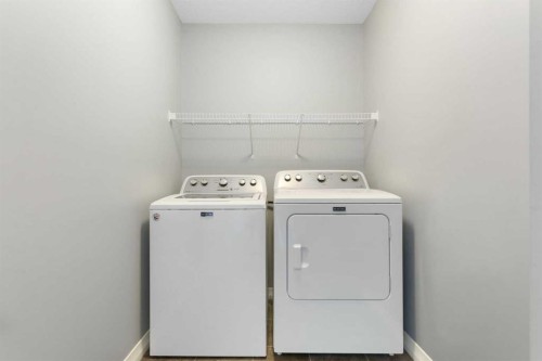 132 Kingsbury Close Se, Airdrie, AB - Indoor Photo Showing Laundry Room