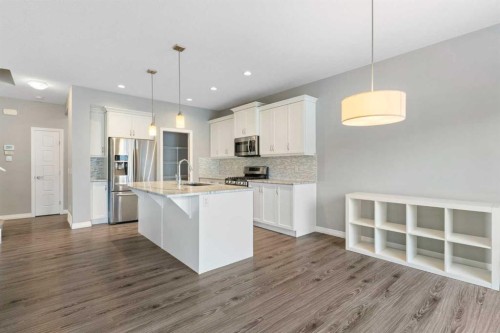 132 Kingsbury Close Se, Airdrie, AB - Indoor Photo Showing Kitchen With Stainless Steel Kitchen With Upgraded Kitchen