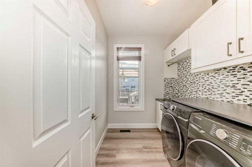 104 Viewpointe Terrace, Chestermere, AB - Indoor Photo Showing Laundry Room