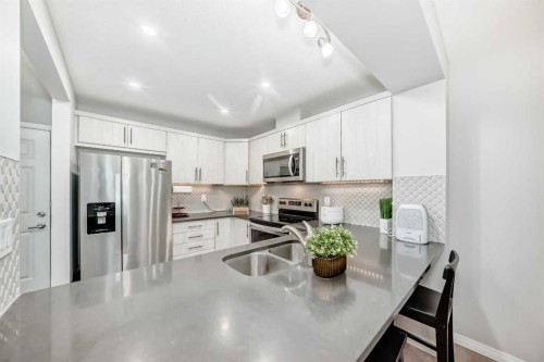 49 Carrington Rise Nw, Calgary, AB - Indoor Photo Showing Kitchen With Double Sink With Upgraded Kitchen