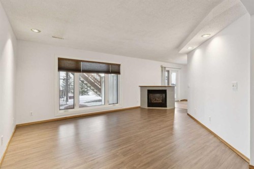 228 Macewan Park View Nw, Calgary, AB - Indoor Photo Showing Living Room With Fireplace