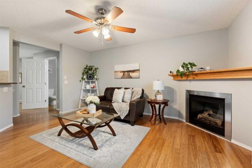 146 Copperstone Grove Se, Calgary, AB - Indoor Photo Showing Living Room With Fireplace
