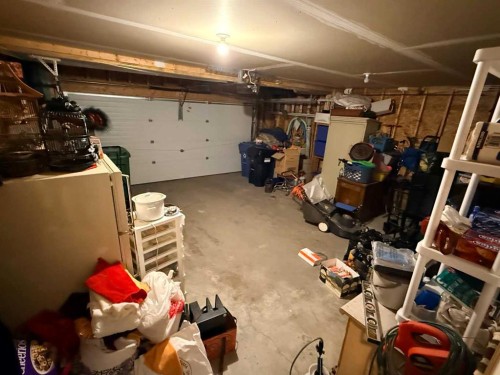 61 Everwoods Close Sw, Calgary, AB - Indoor Photo Showing Garage