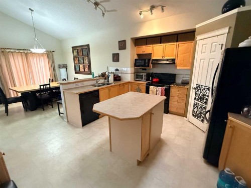 61 Everwoods Close Sw, Calgary, AB - Indoor Photo Showing Kitchen With Double Sink