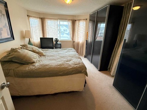 61 Everwoods Close Sw, Calgary, AB - Indoor Photo Showing Bedroom