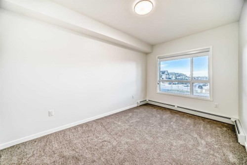 212-245 Edith Place Nw, Calgary, AB - Indoor Photo Showing Other Room