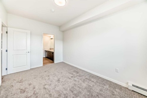 212-245 Edith Place Nw, Calgary, AB - Indoor Photo Showing Other Room