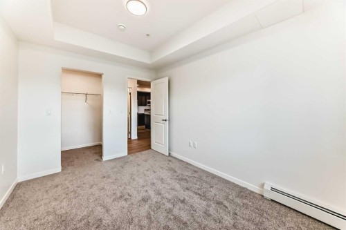 212-245 Edith Place Nw, Calgary, AB - Indoor Photo Showing Other Room