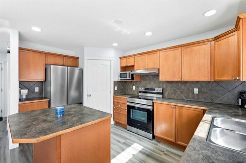 129 Luxstone Green Sw, Airdrie, AB - Indoor Photo Showing Kitchen With Stainless Steel Kitchen With Double Sink