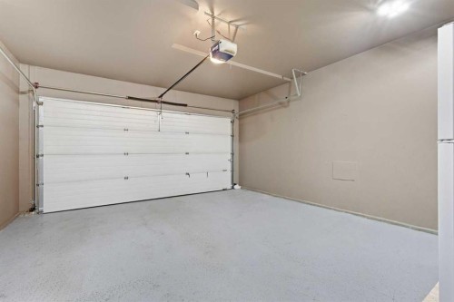 129 Luxstone Green Sw, Airdrie, AB - Indoor Photo Showing Garage
