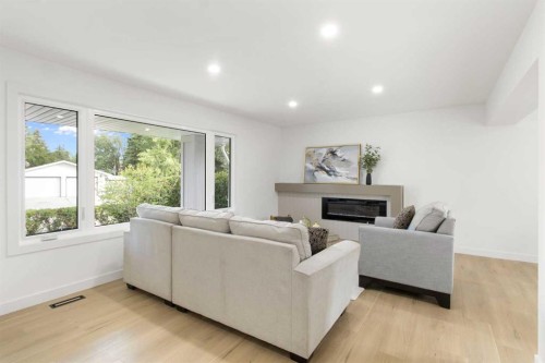 472 Cedarille Crescent Sw, Calgary, AB - Indoor Photo Showing Living Room With Fireplace