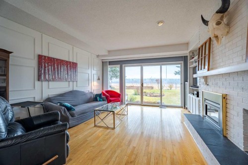 2427 Deer Side Drive, Calgary, AB - Indoor Photo Showing Living Room With Fireplace
