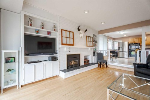 2427 Deer Side Drive, Calgary, AB - Indoor Photo Showing Living Room With Fireplace