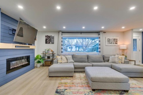 1324 Lake Sylvan Drive Se, Calgary, AB - Indoor Photo Showing Living Room With Fireplace