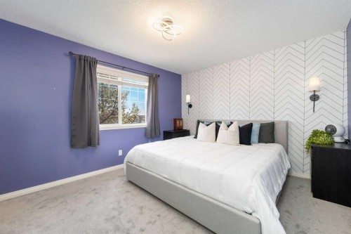 3-41 Hunters Gate, Okotoks, AB - Indoor Photo Showing Bedroom