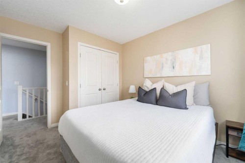 3-41 Hunters Gate, Okotoks, AB - Indoor Photo Showing Bedroom
