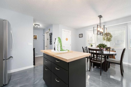 3-41 Hunters Gate, Okotoks, AB - Indoor Photo Showing Dining Room