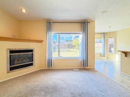 21 Panamount Hill Nw, Calgary, AB - Indoor Photo Showing Living Room With Fireplace