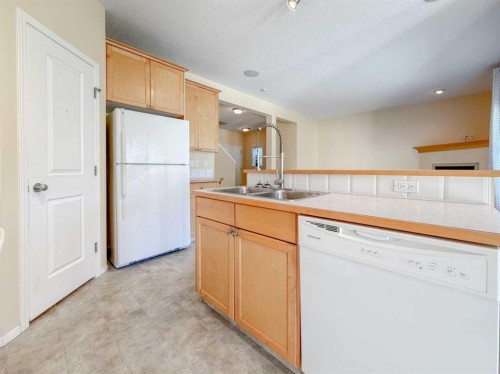 21 Panamount Hill Nw, Calgary, AB - Indoor Photo Showing Kitchen With Double Sink