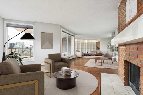 2D-215 2 Street Ne, Calgary, AB - Indoor Photo Showing Living Room With Fireplace