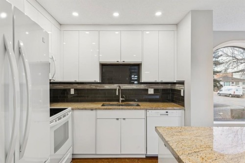 2D-215 2 Street Ne, Calgary, AB - Indoor Photo Showing Kitchen With Double Sink