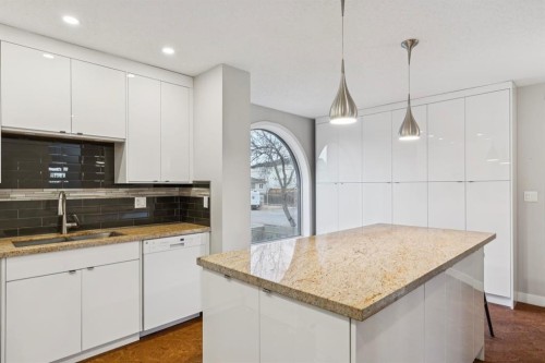 2D-215 2 Street Ne, Calgary, AB - Indoor Photo Showing Kitchen With Double Sink