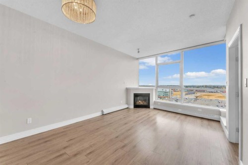 1205-55 Spruce Place Sw, Calgary, AB - Indoor Photo Showing Other Room With Fireplace