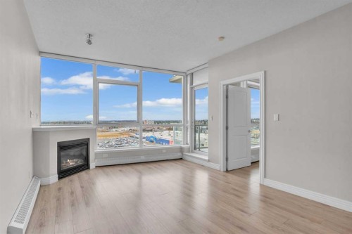 1205-55 Spruce Place Sw, Calgary, AB - Indoor Photo Showing Living Room With Fireplace
