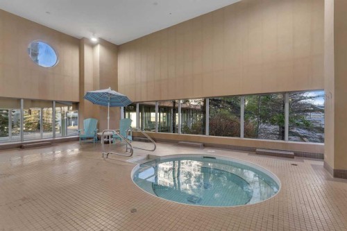 1205-55 Spruce Place Sw, Calgary, AB - Indoor Photo Showing Other Room With In Ground Pool