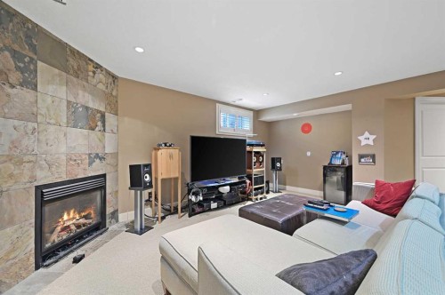 41 Strathridge Crescent Sw, Calgary, AB - Indoor Photo Showing Living Room With Fireplace