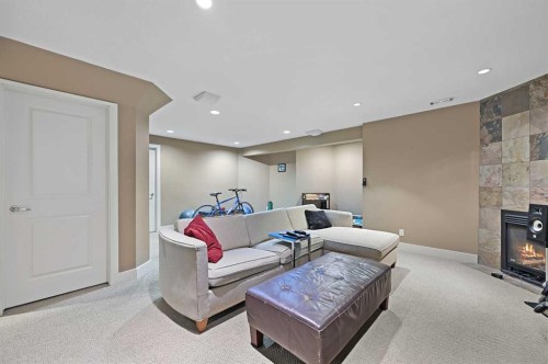 41 Strathridge Crescent Sw, Calgary, AB - Indoor Photo Showing Other Room With Fireplace