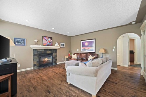 41 Strathridge Crescent Sw, Calgary, AB - Indoor Photo Showing Living Room With Fireplace