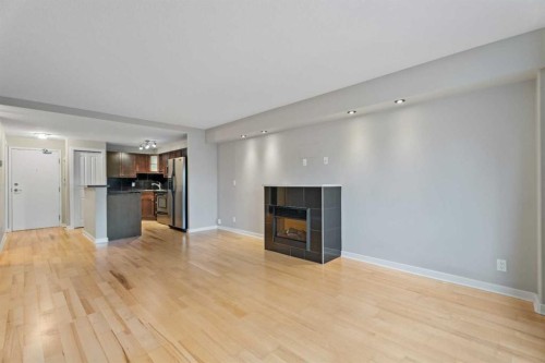 404-728 3 Avenue Nw, Calgary, AB - Indoor Photo Showing Other Room With Fireplace