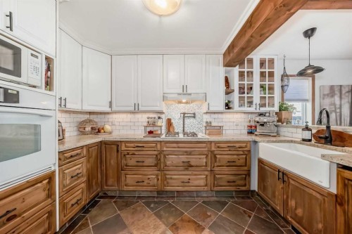 99 Covewood Park Ne, Calgary, AB - Indoor Photo Showing Kitchen With Double Sink