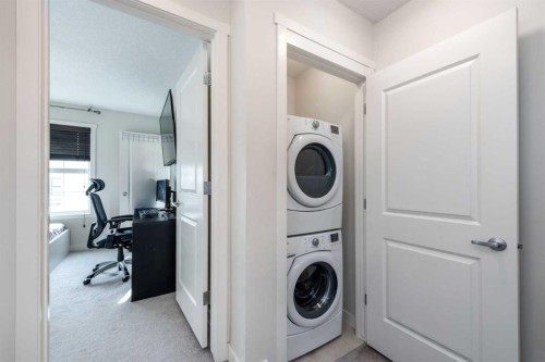 408 Nolanfield Villas Nw, Calgary, AB - Indoor Photo Showing Laundry Room
