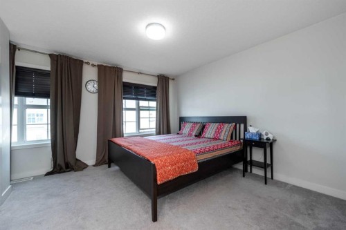 408 Nolanfield Villas Nw, Calgary, AB - Indoor Photo Showing Bedroom