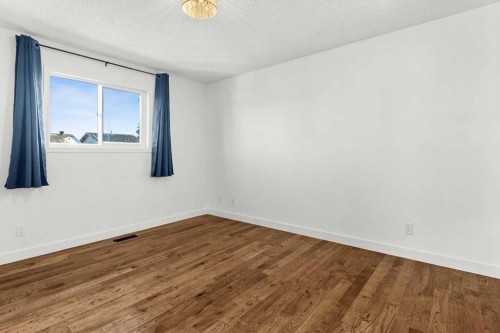73 Sunvale Crescent Se, Calgary, AB - Indoor Photo Showing Other Room