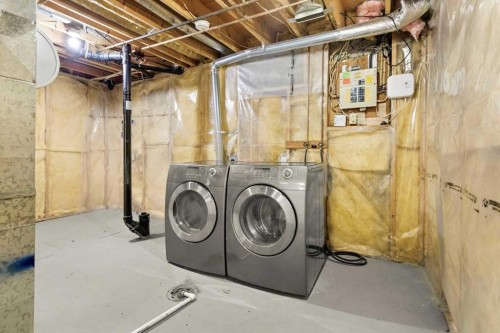73 Sunvale Crescent Se, Calgary, AB - Indoor Photo Showing Laundry Room