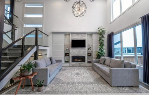 214 Aspenmere Green, Chestermere, AB - Indoor Photo Showing Living Room With Fireplace